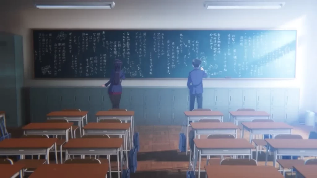 A screenshot of Komi (left) & Tadano (right) writing on a blackboard in japanese. 